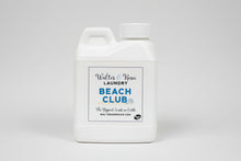 Load image into Gallery viewer, White laundry detergent container with 'Beach Club' label on a gray surface