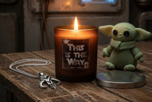 Load image into Gallery viewer, Candle with 'This is the Way' quote, Yoda figurine, and necklace on a wooden surface.