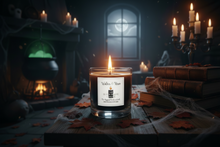 Load image into Gallery viewer, A lit candle in a clear glass jar sits on a rustic wooden table in a moody Halloween-themed room. The label reads 'Walden Woods'.
